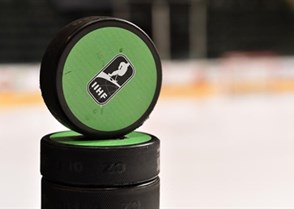 GRAND FORKS, NORTH DAKOTA - APRIL 19: IIHF warm-up pucks sit on the dasher prior to preliminary round action between Finland and Canada at the 2016 IIHF Ice Hockey U18 World Championship. (Photo by Minas Panagiotakis/HHOF-IIHF Images)

