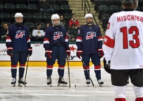 GRAND FORKS, NORTH DAKOTA - APRIL 19: USA's William Lockwood #10, Adam Fox #8 and Graham McPhee #21 look on during the player announcements prior to preliminary round action against Switzerland at the 2016 IIHF Ice Hockey U18 World Championship. (Photo by Minas Panagiotakis/HHOF-IIHF Images)

